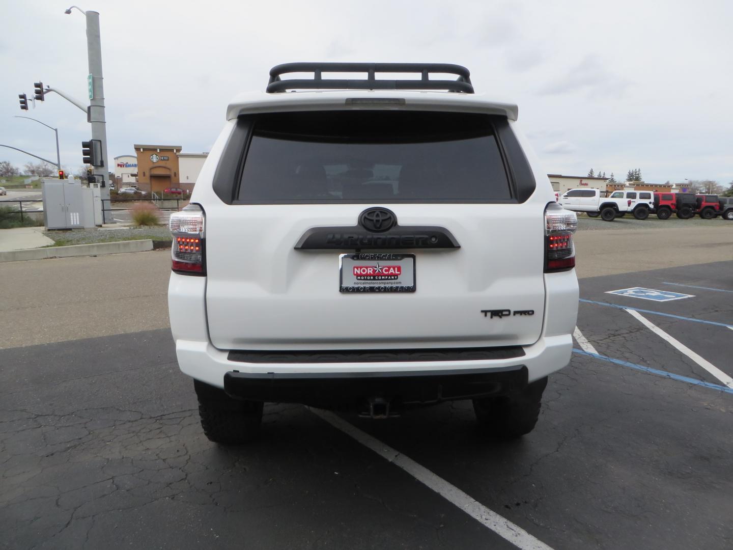 2019 White /BLACK Toyota 4Runner TRD Pro (JTEBU5JR3K5) with an 4.0L V6 engine, 5 -Speed Automatic transmission, located at 2630 Grass Valley Highway, Auburn, CA, 95603, (530) 508-5100, 38.937893, -121.095482 - Features Ironman 4X4 suspension, BFG tires, Rockslider, Roof rack, window tint, and interior Rago Fab Molle storage racks. - Photo#5